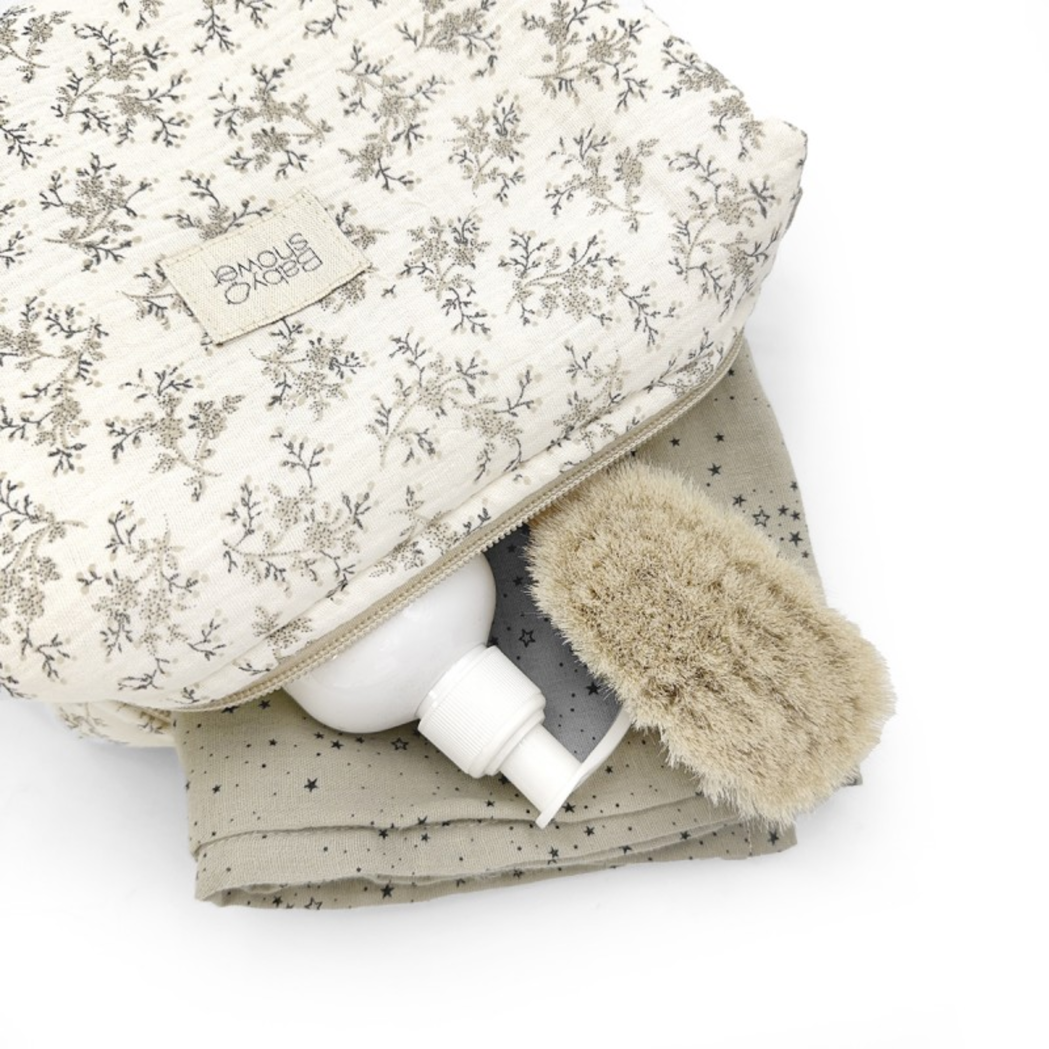 תיק רחצה מעוטר בענפים אפורים שוכב