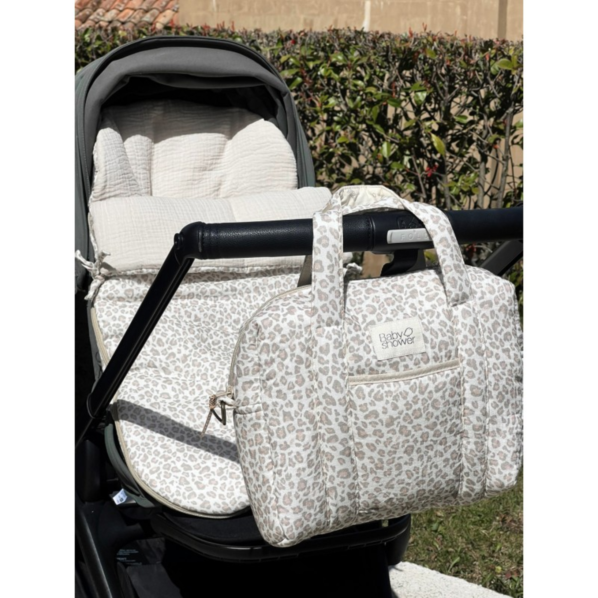 סט מנומר הכולל תיק עגלה + תיק חיתולים תואם